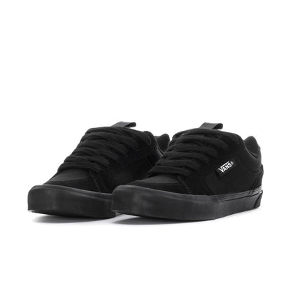 Black lace-up chukka-style sneakers, low profile, Vans logo on side