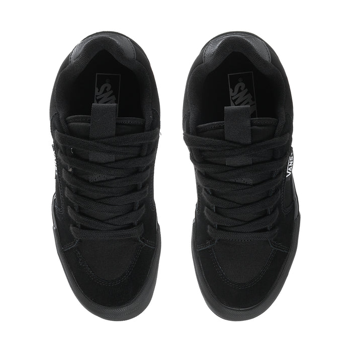 Black chukka-style sneakers with lace closure and padded collar, Vans logo