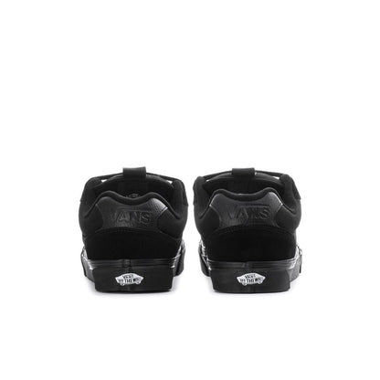 Black chukka-style sneakers showing heel panel with Vans logo details