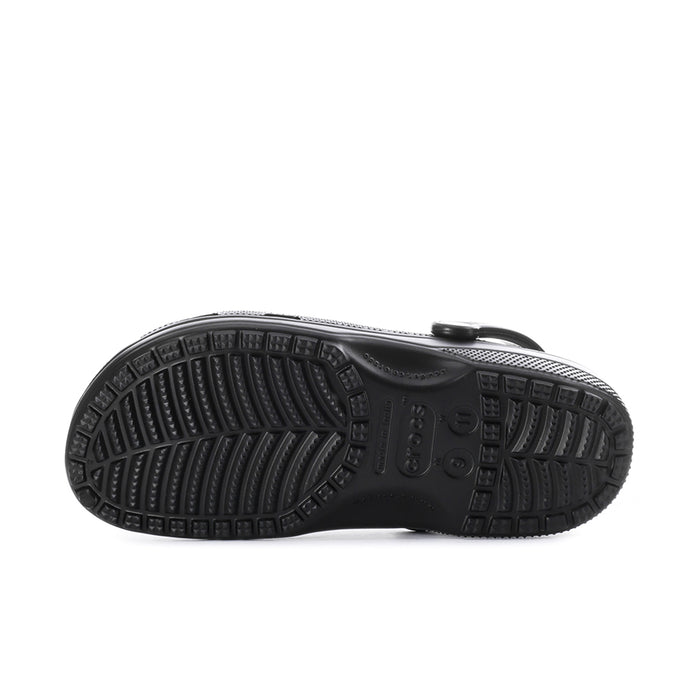 Black men's clog outsole with molded tread pattern underside