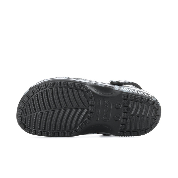 Men's camo clog outsole with deep tread and textured grip pattern