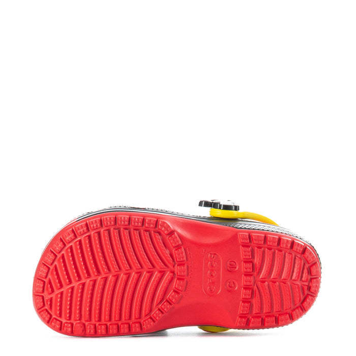 Kids’ clog outsole view with red tread pattern and yellow heel accent