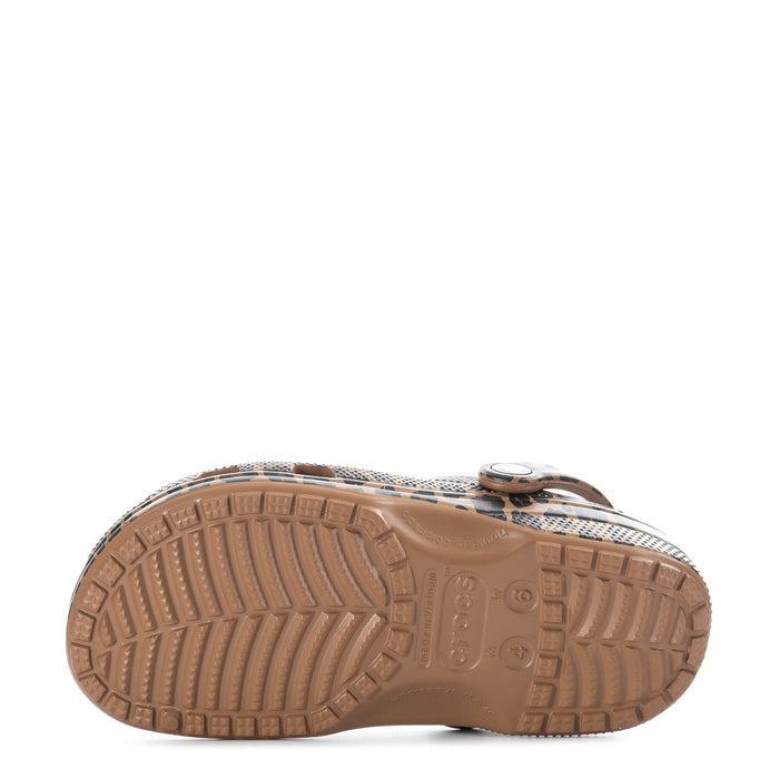 Women's leopard-print clog outsole view with textured tread and logo hardware