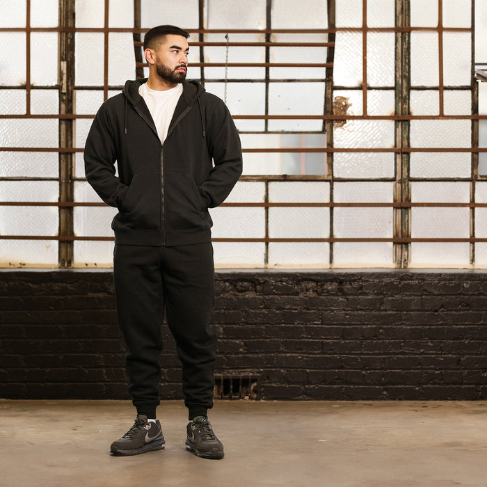 Black zip-up fleece hoodie with hood drawstrings and kangaroo pocket, front view