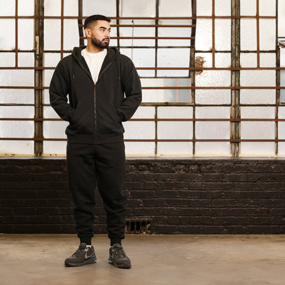Black zip-up fleece hoodie with hood drawstrings and kangaroo pocket, front view