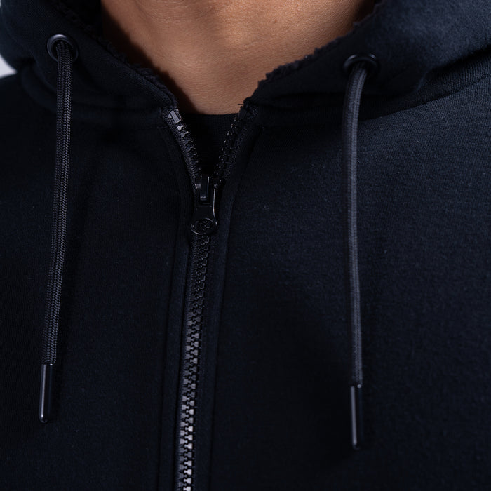 Black fleece hoodie zipper and hood drawstrings, close-up