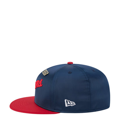 Two-tone satin baseball cap with white New Era logo on navy crown and red brim