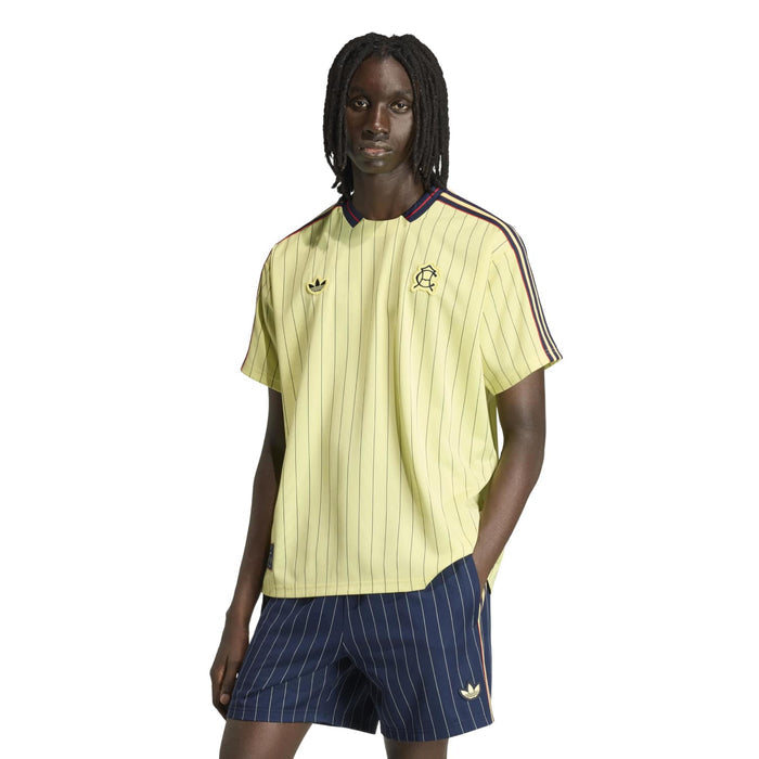 Mens light yellow pinstripe jersey with navy/red shoulder stripe detail and chest crest