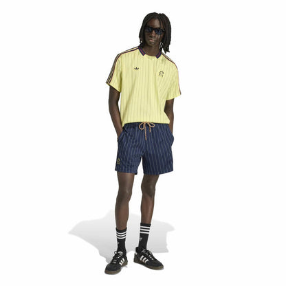 Mens light yellow pinstripe soccer jersey with navy/red trim at collar and shoulders
