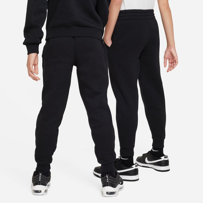 Kids black jogger pants with ribbed cuffs and Nike swoosh on lower leg