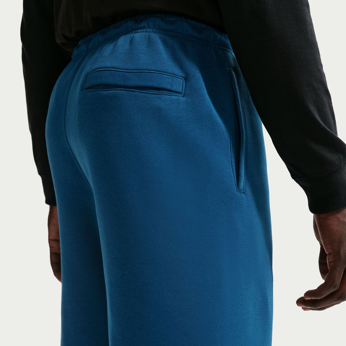 Blue fleece shorts back view with waistband seam and stitched pocket opening