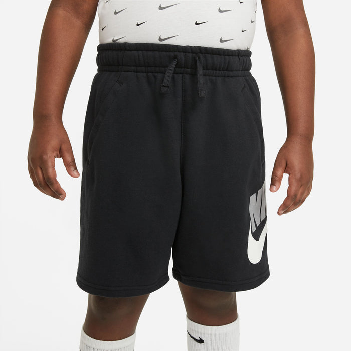 Youth black Nike athletic shorts with elastic waistband and white swoosh