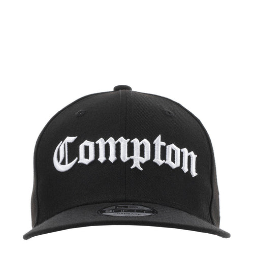 Black baseball cap with white Compton logo on the front panel and curved brim