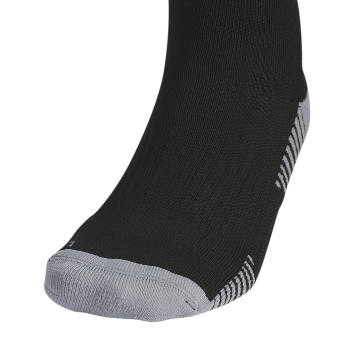 Black sock close-up at ankle with white heel stripe and cushioned sole