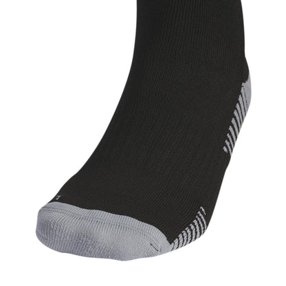 Black sock close-up at ankle with white heel stripe and cushioned sole