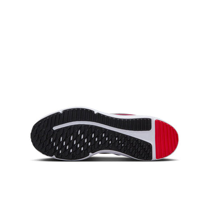 Youth running shoe outsole: black tread with red heel insert and white sidewall