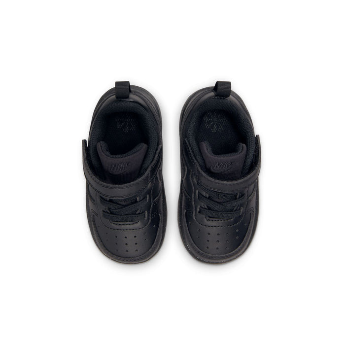 Toddler black low-top sneakers showing padded collars and interior lining