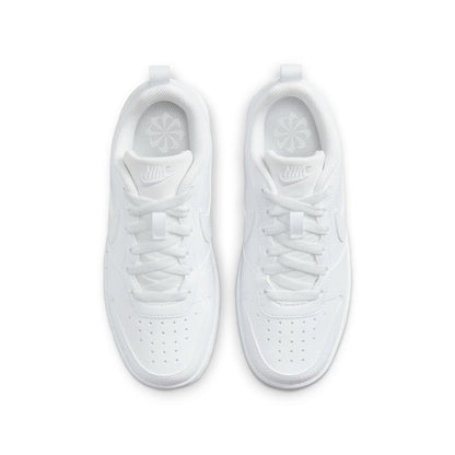 Youth white low-top sneakers, top view with perforated toe and Nike logo