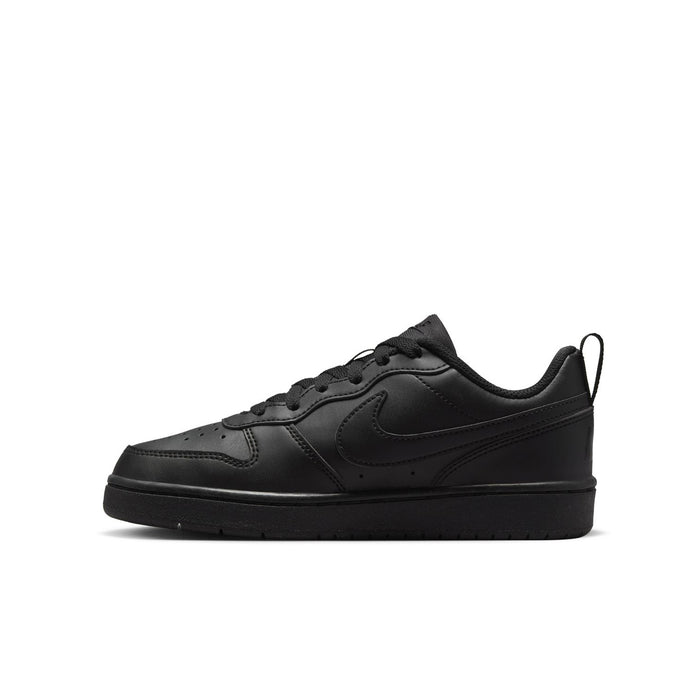 Youth black low-top sneaker side view with swoosh and perforated toe