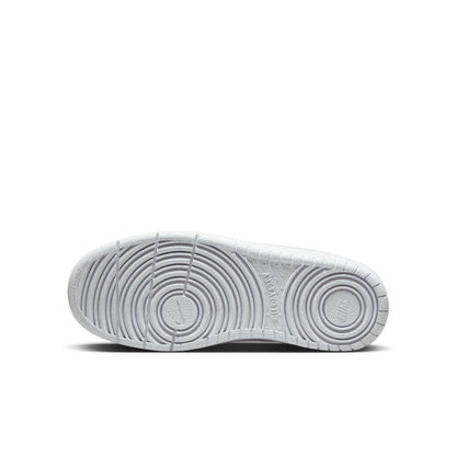 Youth white low-top sneaker outsole with circular traction pattern