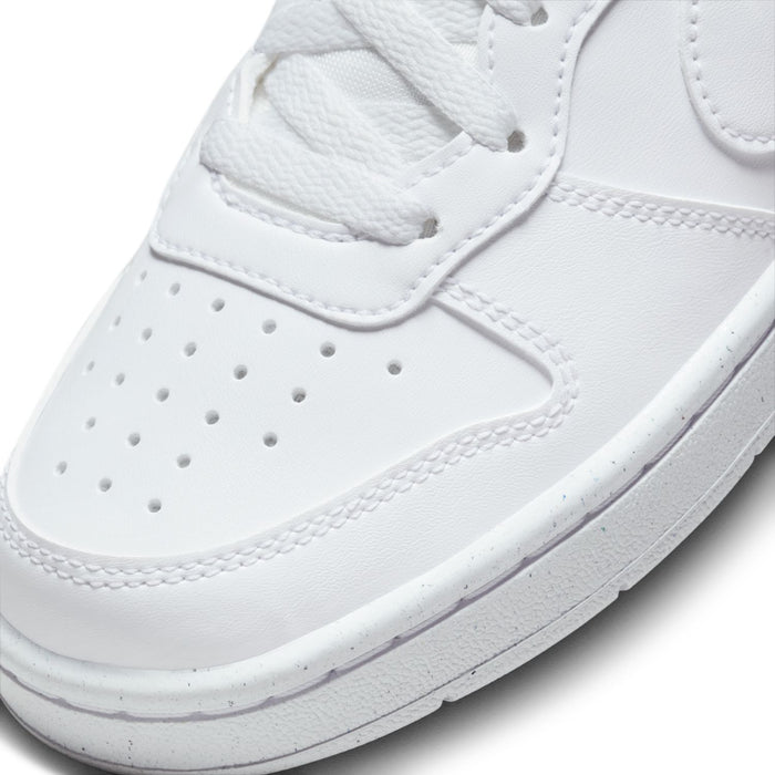 White leather-look sneaker upper close-up with perforated toe and stitched overlays