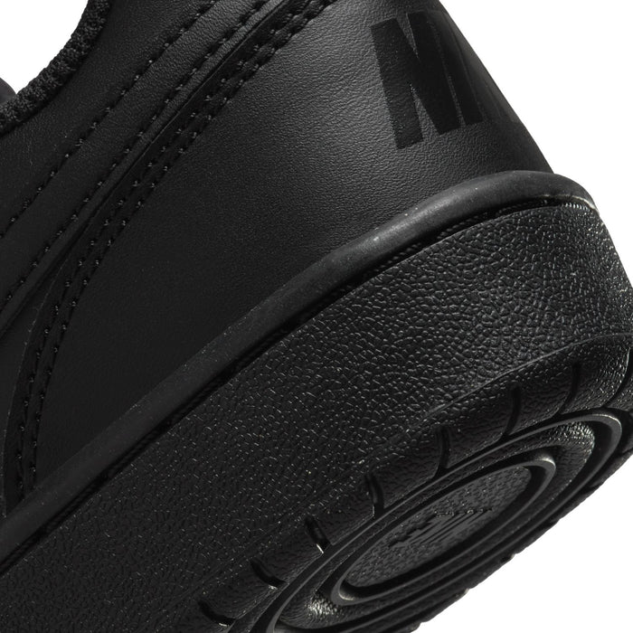 Youth black sneaker side detail with textured upper and molded midsole edge
