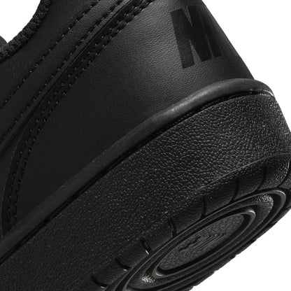 Youth black sneaker side detail with textured upper and molded midsole edge
