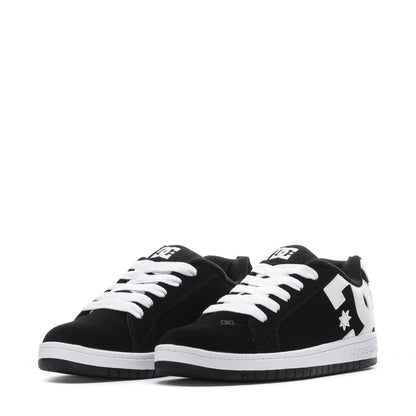 Youth black low-top sneakers with white laces, white tongue logo, and star detail