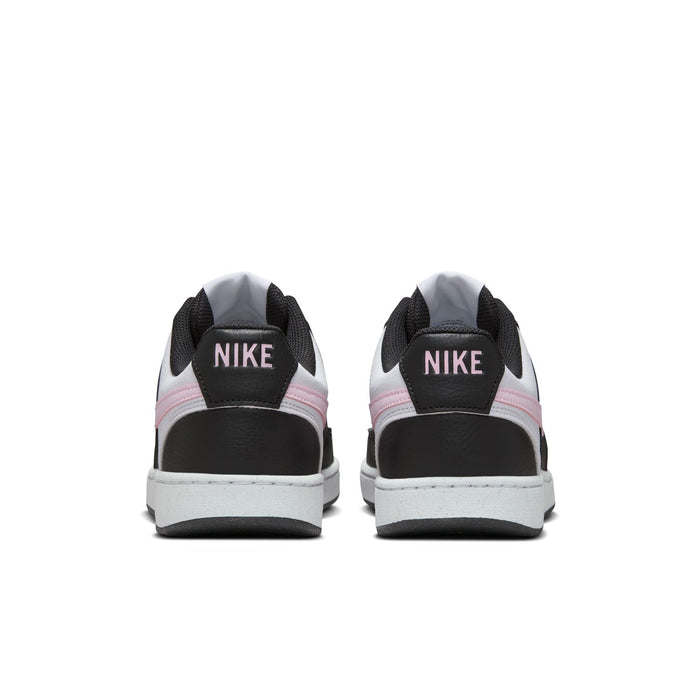 Back view of low-top sneakers with NIKE branding on black heel tabs and white midsoles