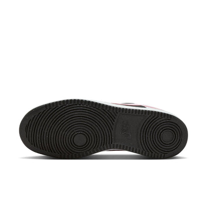 Rubber outsole of low-top sneakers with circular traction pattern and brand mark