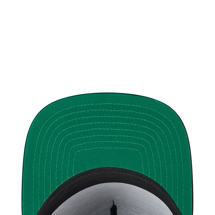 A-frame cap brim underside in green with visible stitching and black inner band