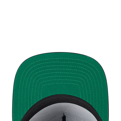 A-frame cap brim underside in green with visible stitching and black inner band