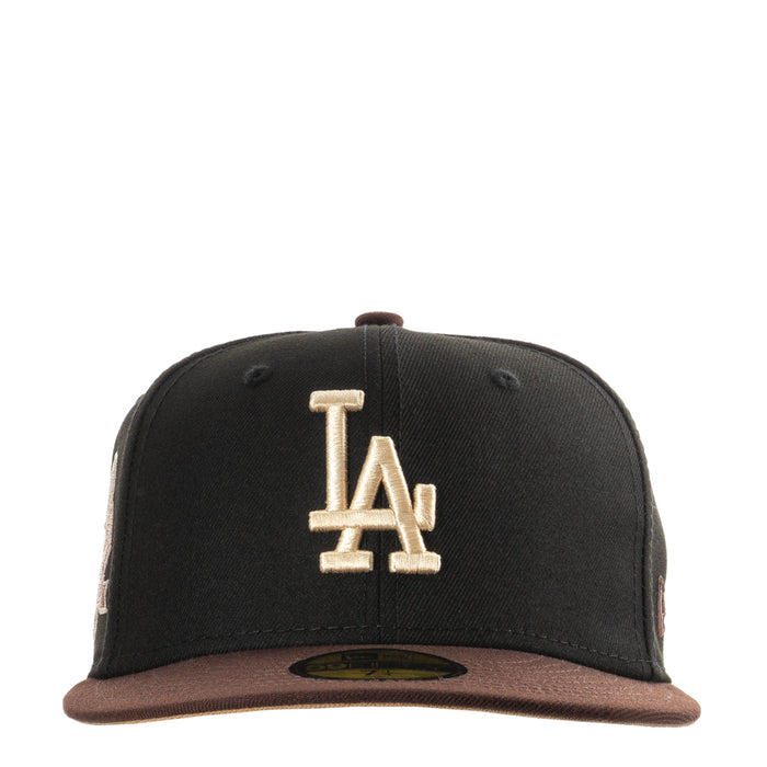 Two-tone black and brown baseball cap with raised LA logo on front