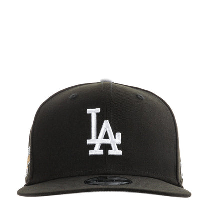 Black baseball cap with white LA logo on front