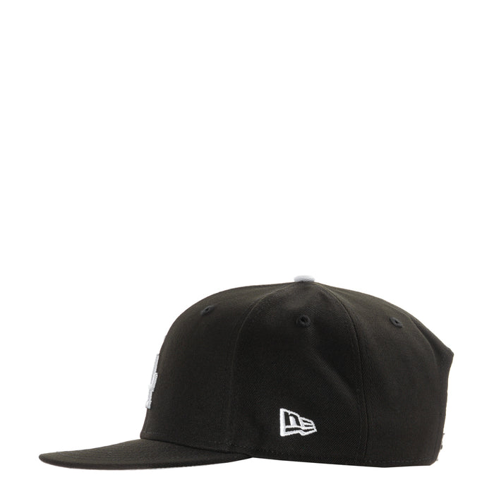 Black baseball cap with New Era logo on side