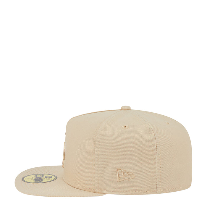 Beige baseball cap with LA logo embroidery on side panels and matching underside badge