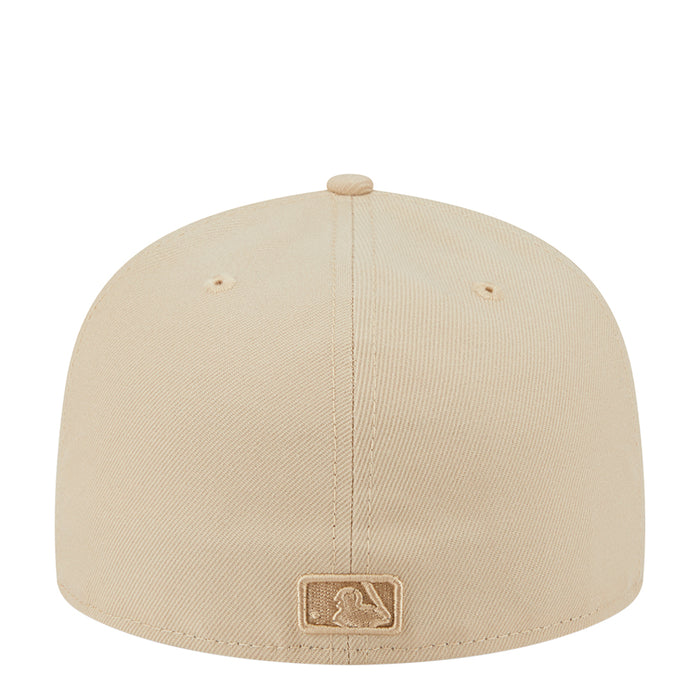 Beige baseball cap with rear embroidered patch and stitched crown panel seams