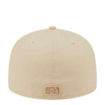 Beige baseball cap with rear embroidered patch and stitched crown panel seams