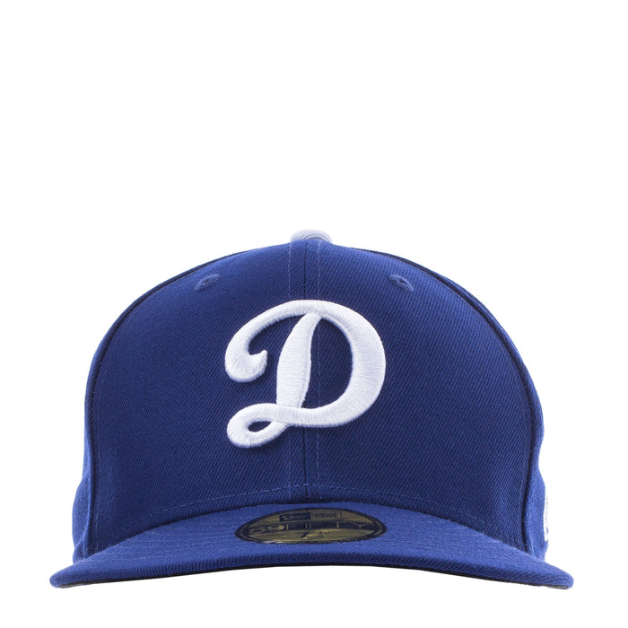 Royal blue baseball cap with white Dodgers D logo on the front panel