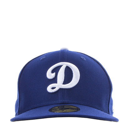 Royal blue baseball cap with white Dodgers D logo on the front panel