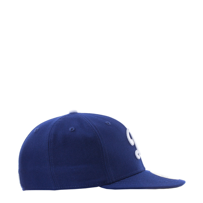 Royal blue baseball cap, side view with white D logo detail