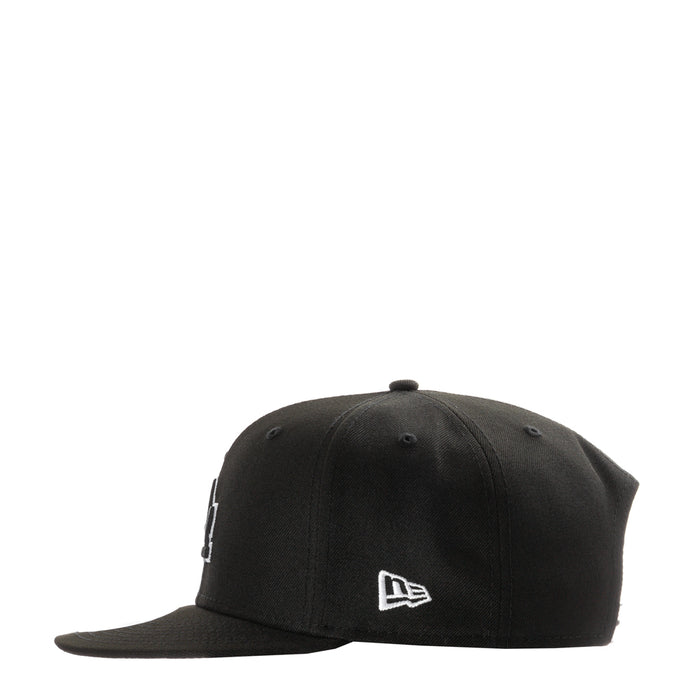 Black baseball cap with small New Era flag logo on front
