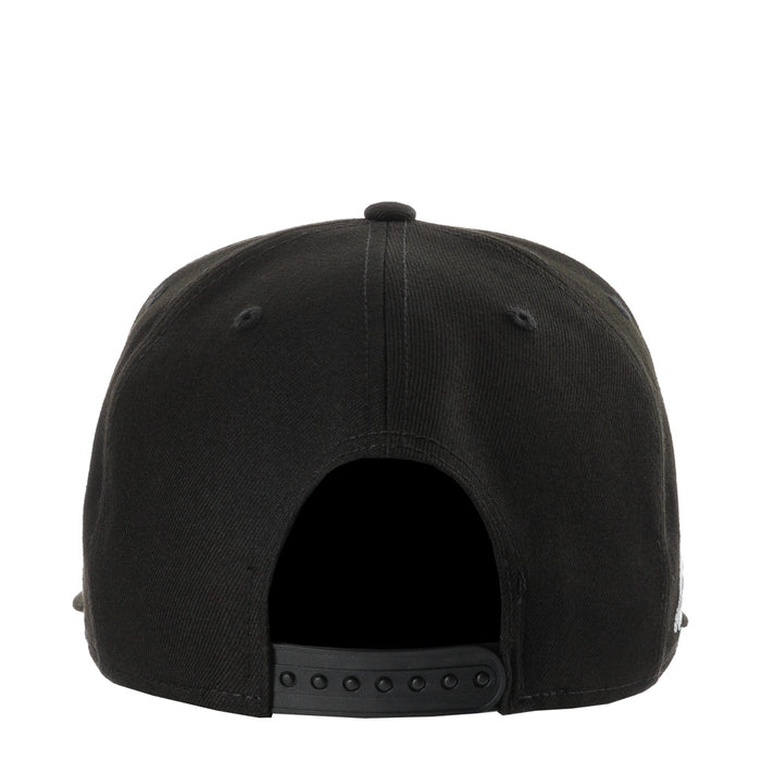 Black baseball cap with curved brim and snapback strap at back