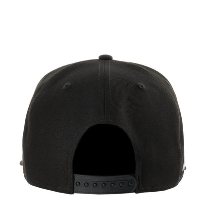 Black baseball cap with curved brim and snapback strap at back