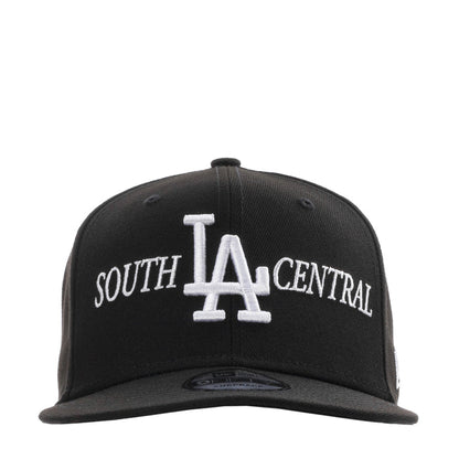 Black baseball cap with white LA and SOUTH CENTRAL embroidery, adjustable back strap