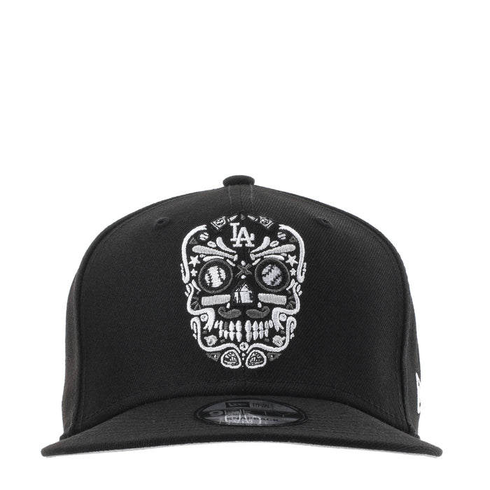Black baseball cap with white embroidered sugar skull and LA logo at front