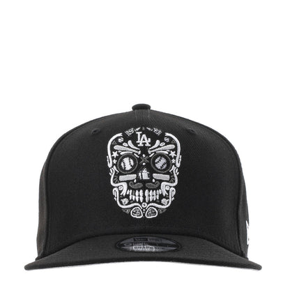 Black baseball cap with white embroidered sugar skull and LA logo at front