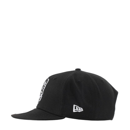 Black baseball cap with New Era logo and white chain embroidery on side
