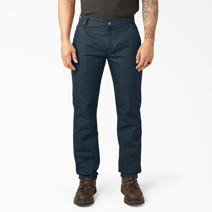 Mens dark blue carpenter pants on model, straight leg with cargo-style side pockets