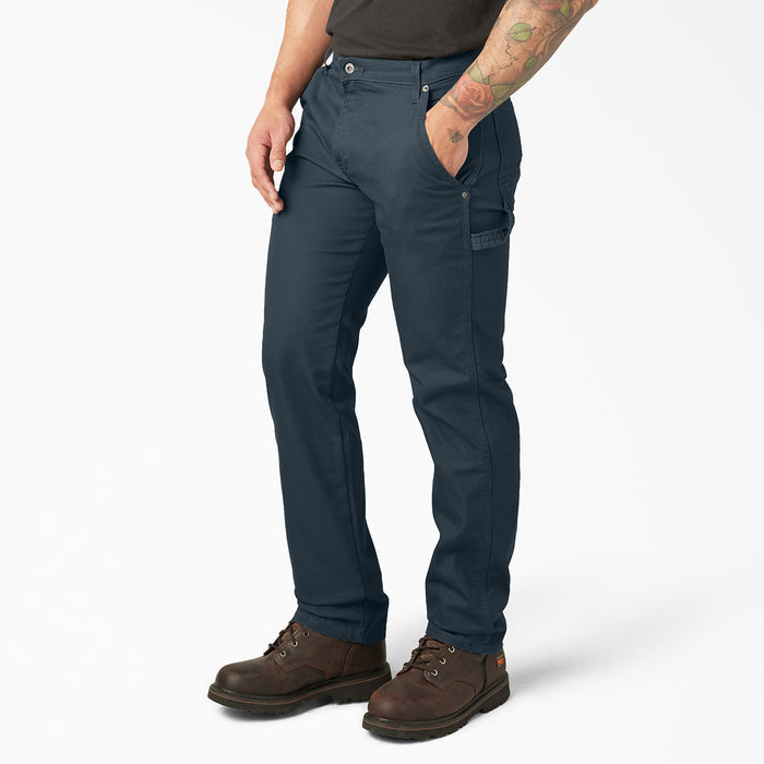 Mens dark blue carpenter pants, side view showing knee crease and utility side pockets